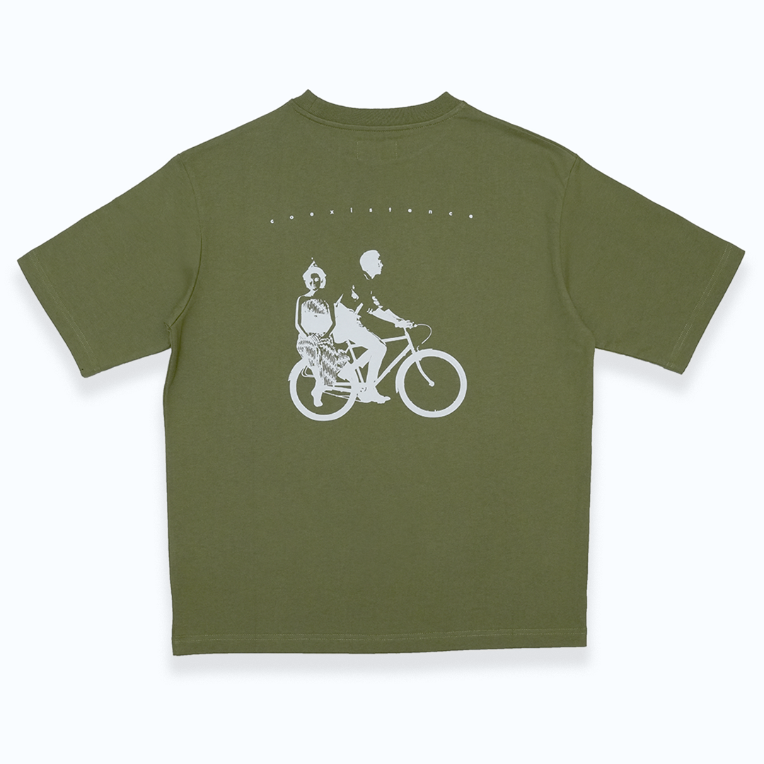 Boxy green t-shirt with a white graphic on the back